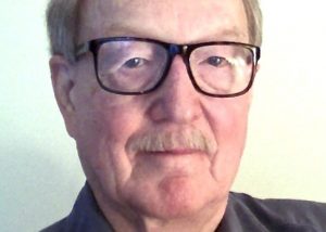 Alan Dowty, wearing glasses, looking serious